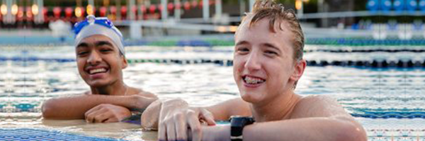 Photo of two young swimmers in the pool participating in the Para START program