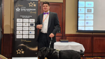 Image of Paul Harpur receiving the Blind Australian of the Year award at a ceremony hosted by the Link Vision charity