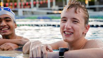 Photo of two young swimmers in the pool participating in the Para START program